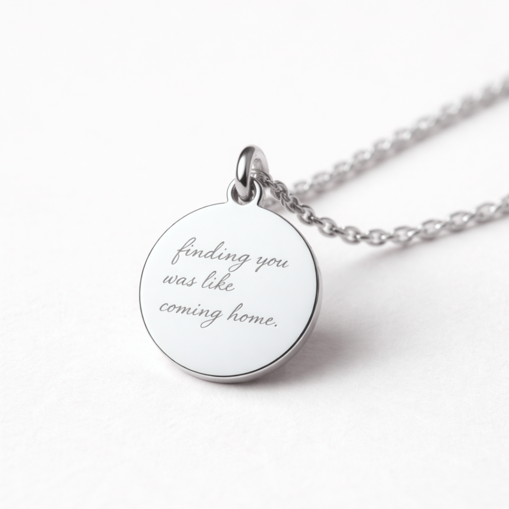 Angled close-up detail of custom engraved 925 sterling silver 16mm coin pendant necklace on diamond-cut cable chain, personalised handwritten message "finding you was like coming home" faithfully diamond-head engraved on polished disc – Atelier By Dsgn custom handwriting jewellery thoughtful gift for her, anniversary, valentines day or sympathy keepsake