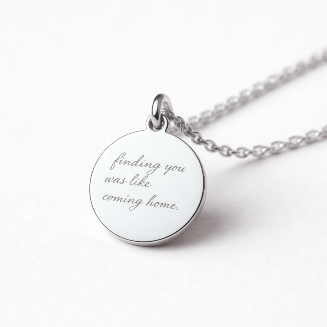 Angled close-up detail of custom engraved 925 sterling silver 16mm coin pendant necklace on diamond-cut cable chain, personalised handwritten message "finding you was like coming home" faithfully diamond-head engraved on polished disc – Atelier By Dsgn custom handwriting jewellery thoughtful gift for her, anniversary, valentines day or sympathy keepsake