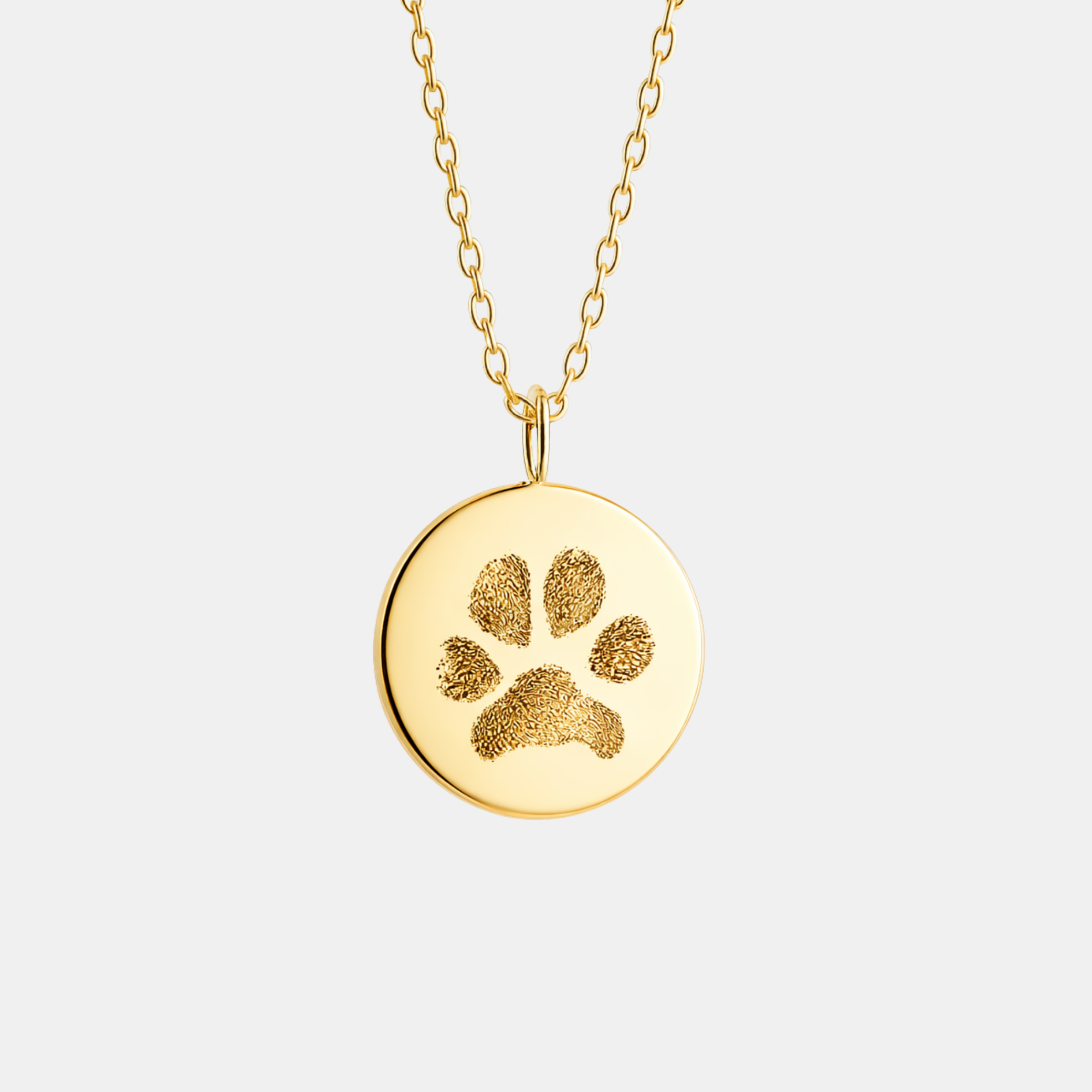 Custom engraved 18k gold vermeil 16mm coin pendant necklace on diamond-cut cable chain, featuring a faithful personalised pet paw print precision diamond-head engraved on warm polished gold disc – Atelier By Dsgn personalised paw print jewellery gift for pet lovers, dog mum, cat mum, pet memorial, rainbow bridge remembrance or gotcha day keepsake necklace
