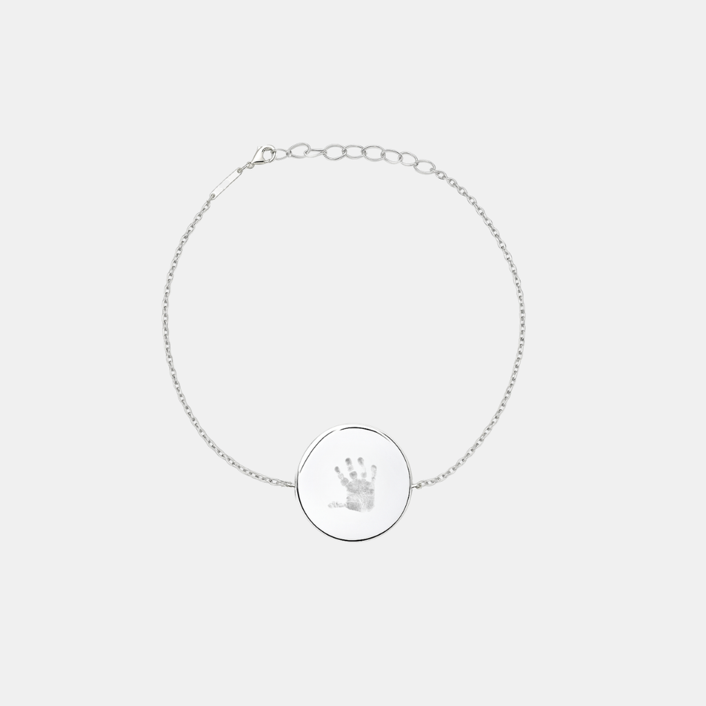 Custom engraved 925 sterling silver adjustable coin bracelet, featuring a personalised baby handprint with intricate finger and palm detail precision diamond-head engraved on polished round disc on delicate diamond-cut cable chain – Atelier By Dsgn custom handprint coin bracelet meaningful gift for new mum, mothers day, baby shower, new baby arrival or treasured newborn family keepsake bracelet