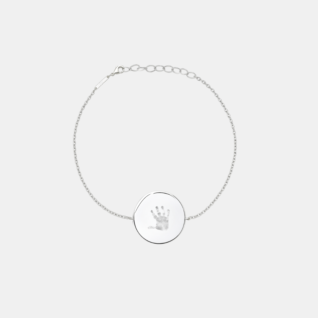 Custom engraved 925 sterling silver adjustable coin bracelet, featuring a personalised baby handprint with intricate finger and palm detail precision diamond-head engraved on polished round disc on delicate diamond-cut cable chain – Atelier By Dsgn custom handprint coin bracelet meaningful gift for new mum, mothers day, baby shower, new baby arrival or treasured newborn family keepsake bracelet
