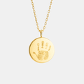 Custom engraved 18k gold vermeil 16mm coin pendant necklace on diamond-cut cable chain, featuring a personalised baby handprint with intricate finger and palm detail precision diamond-head engraved on warm high-polish gold disc – Atelier By Dsgn luxury custom handprint coin necklace meaningful gift for new mum, new dad, mothers day, fathers day, baby shower, new baby arrival or treasured newborn family heirloom necklace