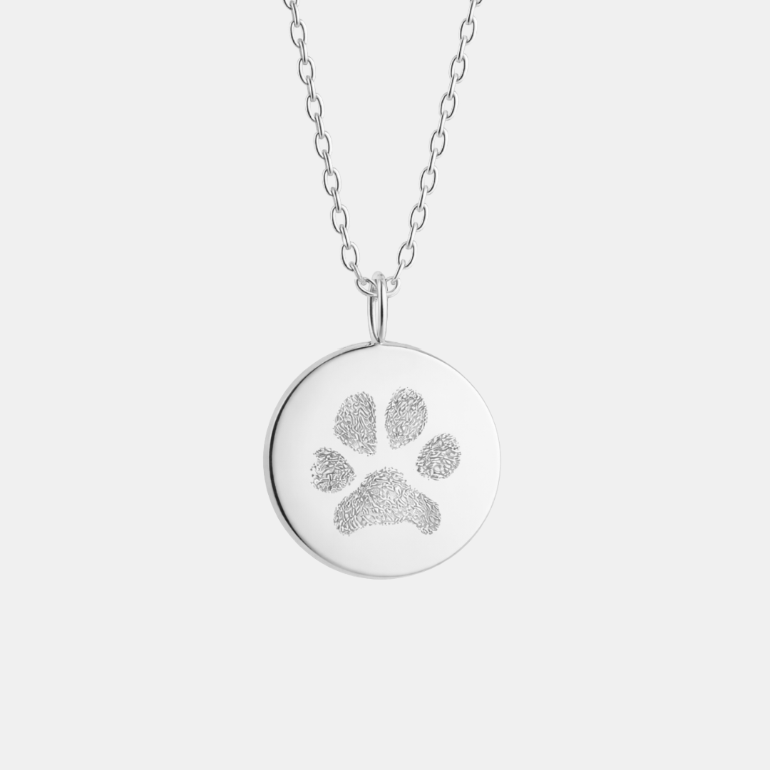 Custom engraved 925 sterling silver 16mm coin pendant necklace on diamond-cut cable chain, featuring a personalised pet paw print with intricate toe and pad texture detail precision diamond-head engraved on polished round disc – Atelier By Dsgn custom paw print pendant jewellery meaningful gift for dog lovers, cat lovers, pet mum, pet dad, pet memorial, rainbow bridge remembrance or new pet adoption keepsake necklace