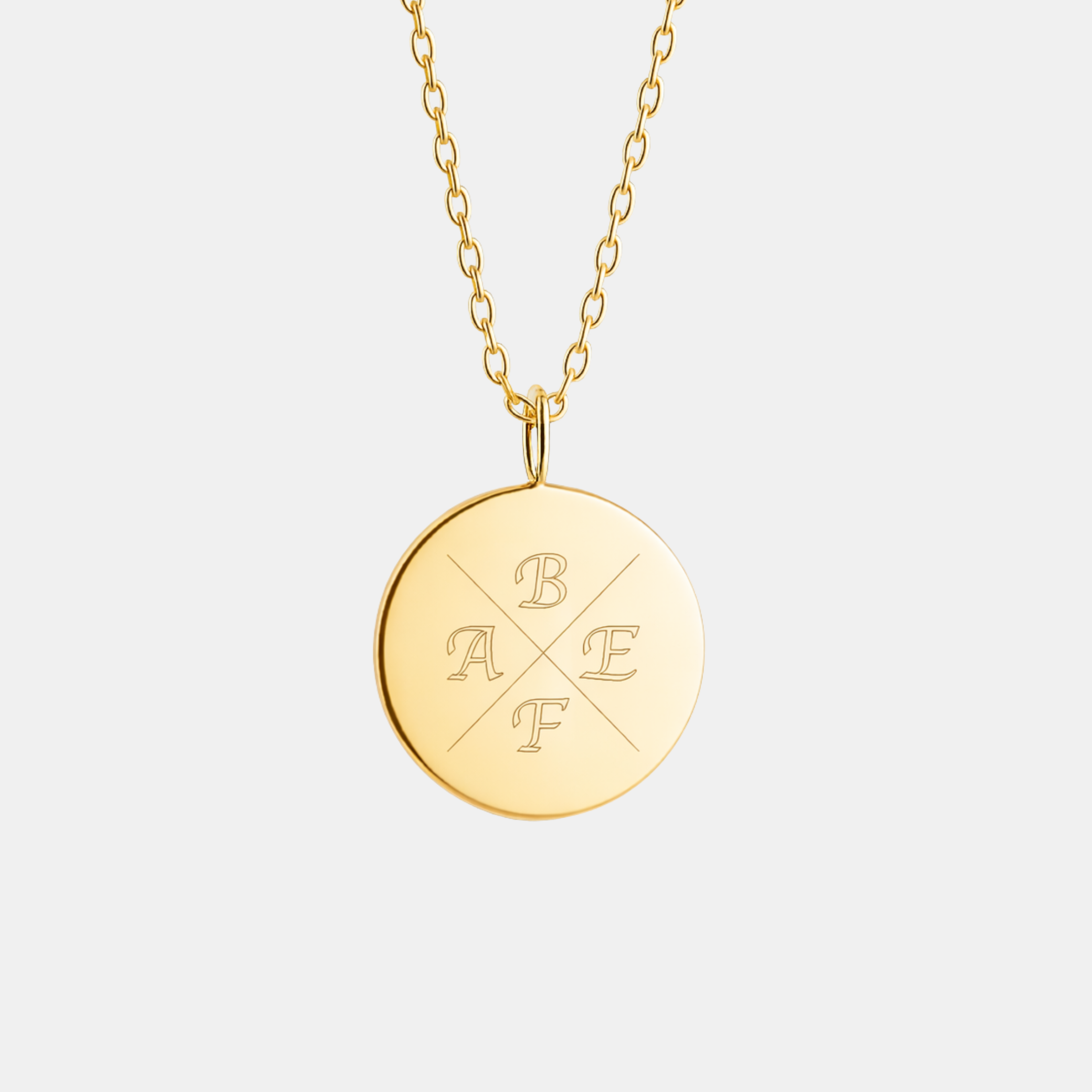 Custom engraved 18k gold vermeil 16mm coin pendant necklace on diamond-cut cable chain, featuring four personalised initials "A, B, E, F" precision diamond-head engraved in elegant cross pattern on warm polished gold disc – Atelier By Dsgn personalised initial coin necklace gift for her, mothers day, family keepsake, birthday or meaningful anniversary heirloom necklace