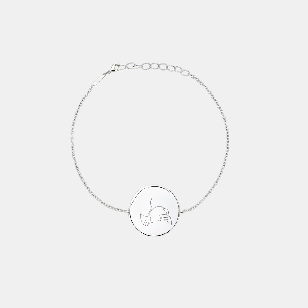 Custom engraved 925 sterling silver adjustable coin bracelet, featuring a personalised single-line minimalist mother and baby portrait precision diamond-head engraved on polished round disc on delicate diamond-cut cable chain – Atelier By Dsgn custom line art portrait coin bracelet meaningful gift for new mum, mothers day, baby shower, birth keepsake or cherished family heirloom bracelet