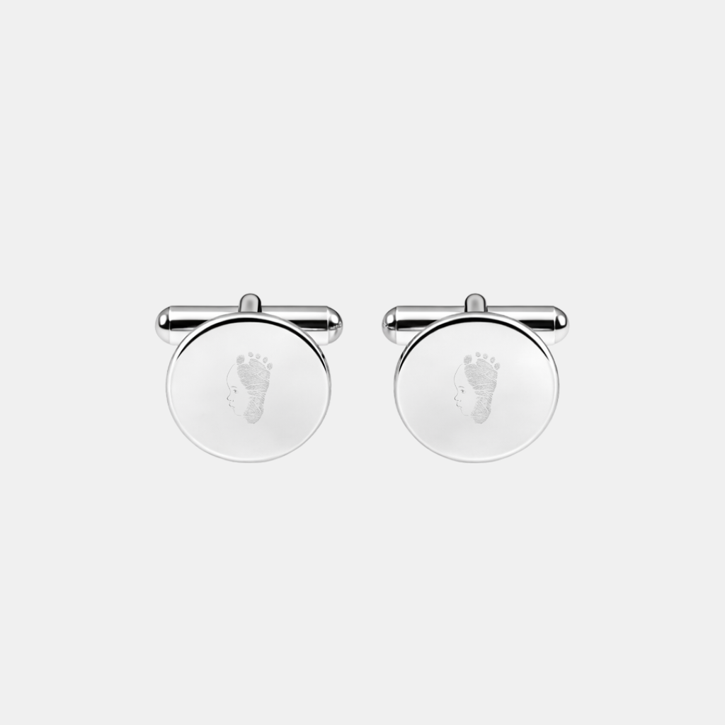 Pair of custom engraved 925 sterling silver round cufflinks featuring personalised single-line minimalist baby side profile portrait uniquely fused with actual baby footprint texture precision diamond-head engraved on polished silver face – Atelier By Dsgn custom fingerprint footprint cufflinks deeply personal gift for new dad, fathers day, wedding day, groomsmen, birth keepsake or treasured newborn family heirloom mens jewellery
