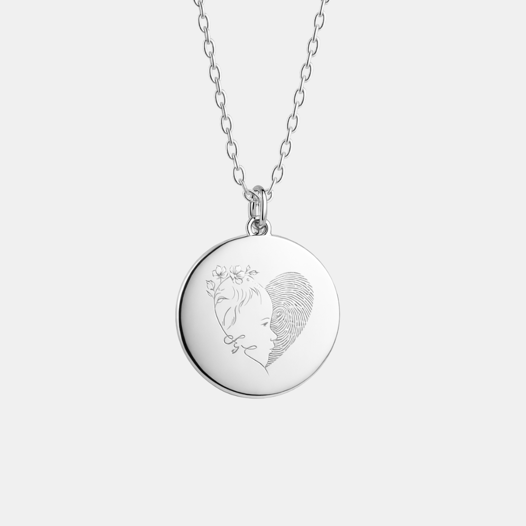 Custom engraved 925 sterling silver 16mm coin pendant necklace on diamond-cut cable chain, featuring a personalised single-line minimalist female side profile portrait with delicate floral detail uniquely fused with actual fingerprint texture precision diamond-head engraved on polished round disc – Atelier By Dsgn custom fingerprint portrait jewellery deeply personal gift for her, mothers day, anniversary, valentines day, birthday or cherished memorial keepsake necklace