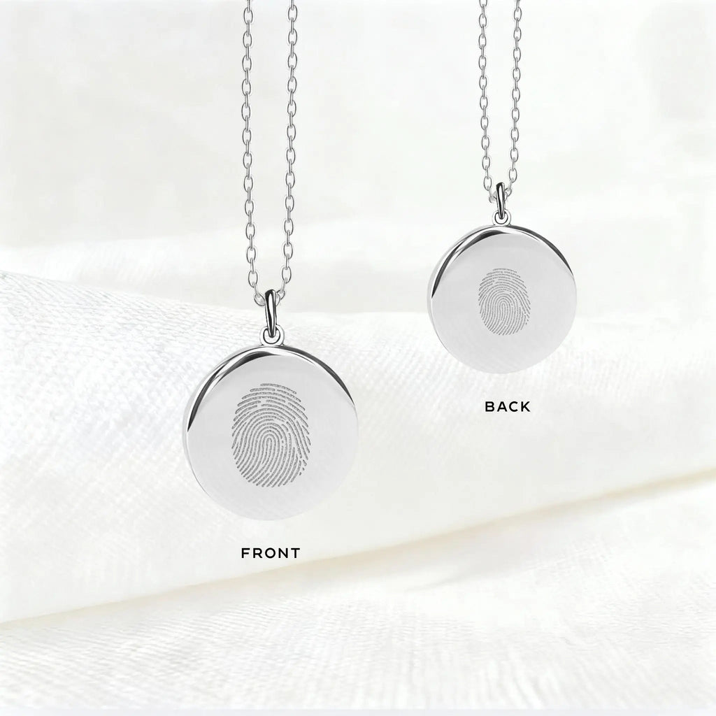 Front and back view of the Atelier By DSGN Single Fingerprint Pendant Necklace in 925 Sterling Silver, showcasing precision diamond-engraved fingerprints on both sides, a personalized keepsake of love, memory, and connection.