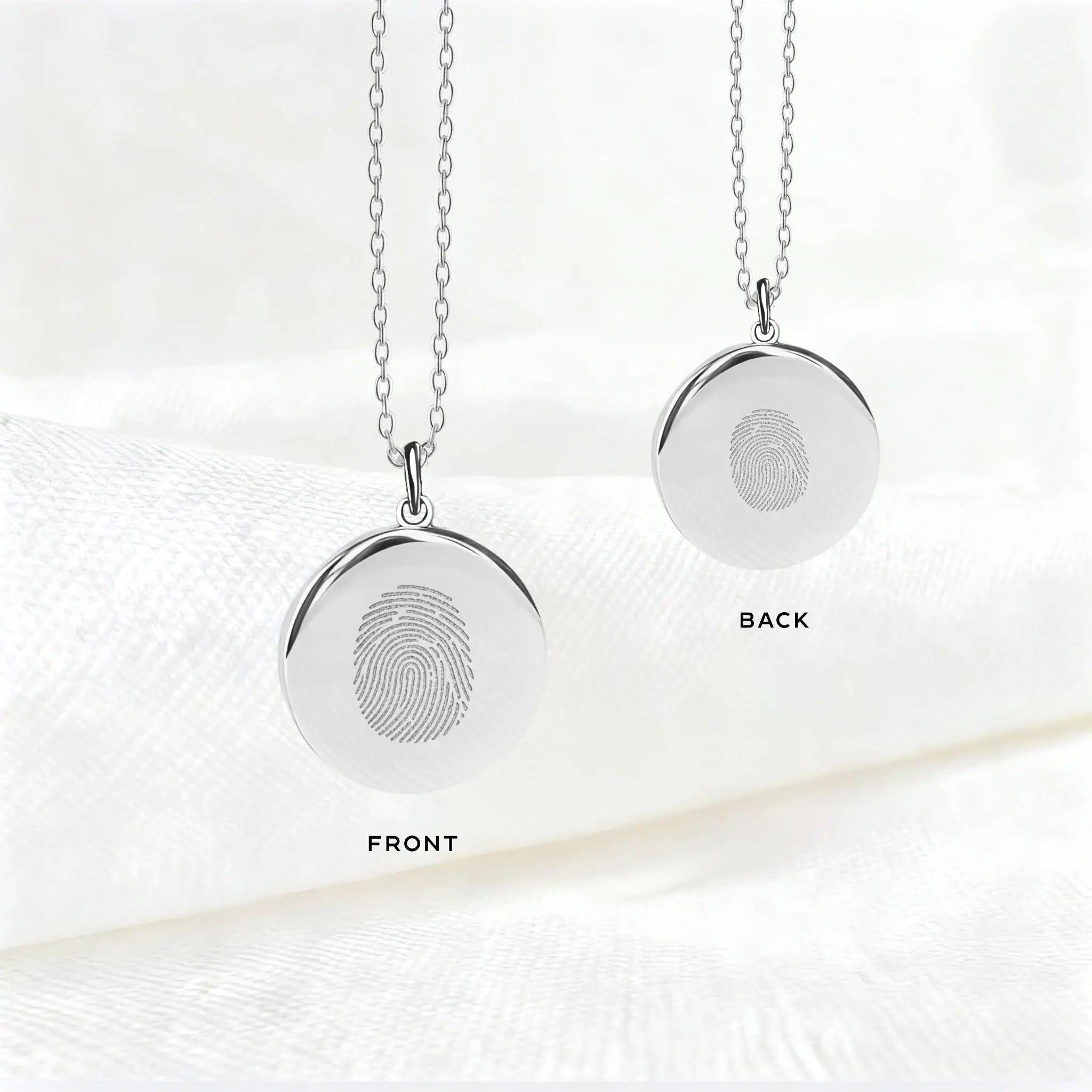 Front and back view of the Atelier By DSGN Single Fingerprint Pendant Necklace in 925 Sterling Silver, showcasing precision diamond-engraved fingerprints on both sides, a personalized keepsake of love, memory, and connection.