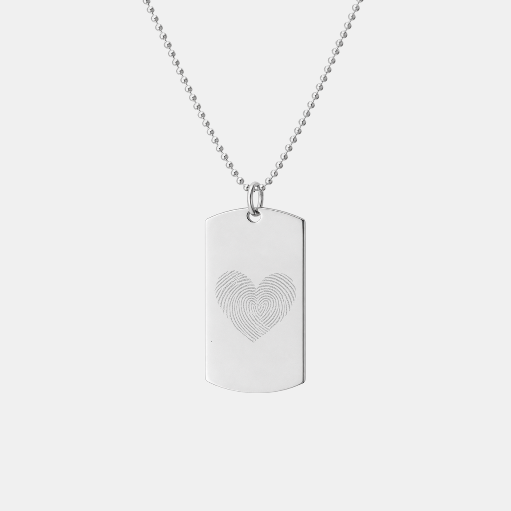 Atelier By DSGN 925 sterling silver dog tag pendant with custom diamond-engraved heart-shaped fingerprint design, displayed hanging on adjustable bead chain