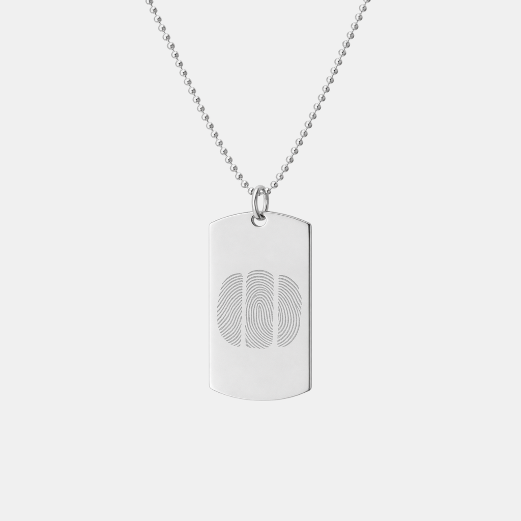 Atelier By DSGN sterling silver dog tag pendant with custom diamond-engraved three side-by-side fingerprint design, displayed hanging on adjustable bead chain