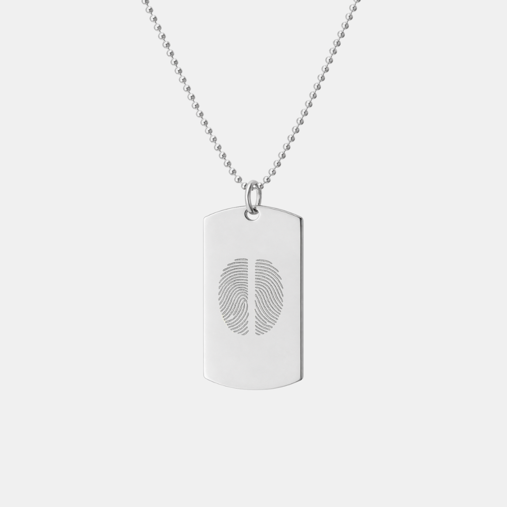 Atelier By DSGN 925 sterling silver dog tag pendant with custom diamond-engraved two side-by-side fingerprint design, displayed hanging on adjustable bead chain