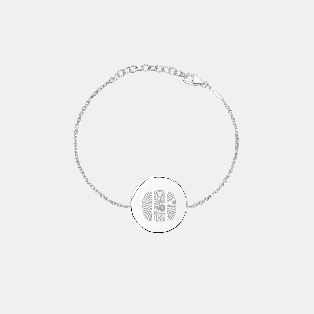 Three fingerprint coin bracelet in 925 sterling silver by Atelier By DSGN, showcasing intricate design and personalized details.