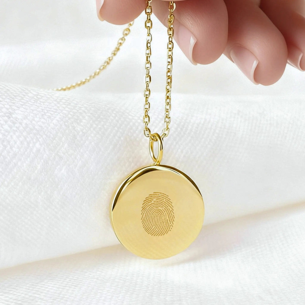 Custom single fingerprint coin necklace in 18k gold vermeil by Atelier By DSGN , featuring a unique pendant design.