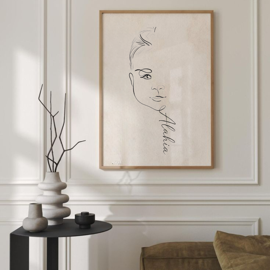 Framed custom single line drawing of a woman's face with personalised name, minimalist portrait wall art displayed in modern living room