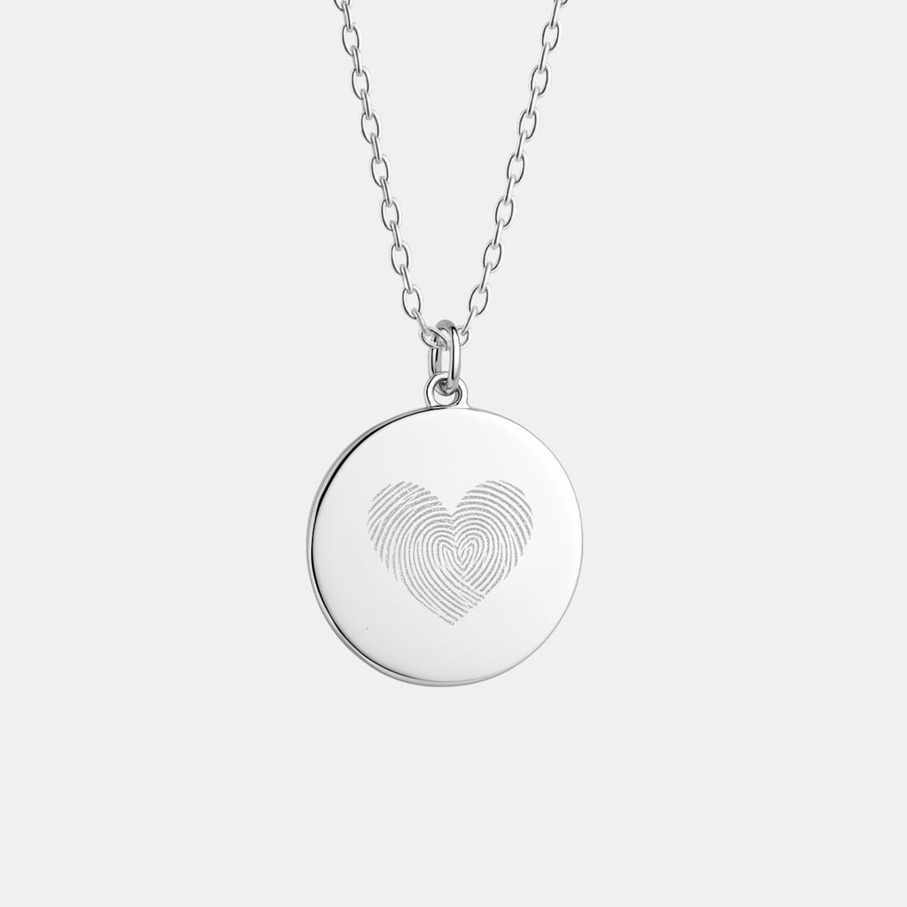 Heart Fingerprint Pendant Necklace by Atelier in 925 Sterling Silver, featuring two fingerprints delicately engraved to form a heart - a timeless personalised keepsake symbolising love, memory, and connection.