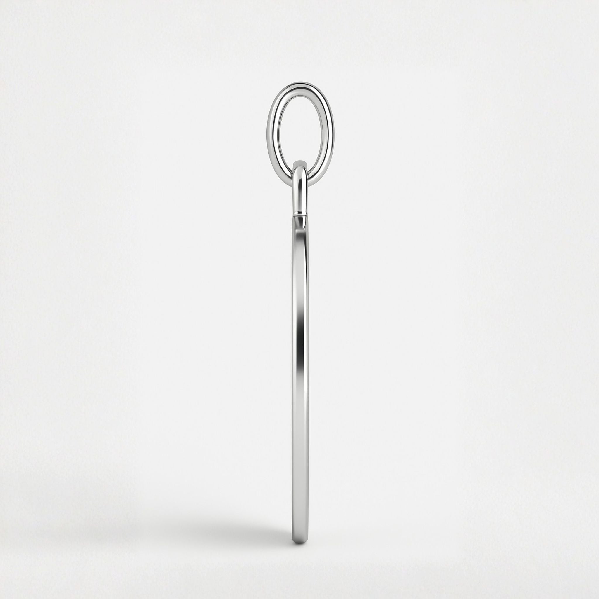 Side view of Atelier Heart Fingerprint Pendant Necklace in 925 Sterling Silver showing the pendant’s refined 1.5mm depth and sleek polished edge, crafted for durability and timeless elegance.