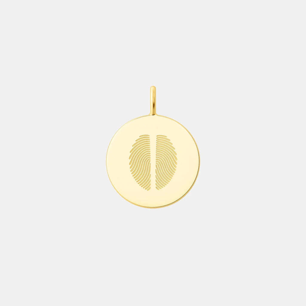 Minimalist two fingerprint pendant crafted in 18K gold vermeil by Atelier By DSGN. Features dual engraved fingerprints on a polished circular disc, an elegant, meaningful keepsake symbolizing love, unity, and connection. Perfect for luxury personalized jewelry collections.