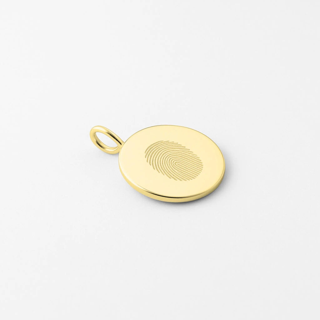 Single fingerprint pendant necklace in 18k gold vermeil by Atelier By DSGN, showcasing custom engraving detail.