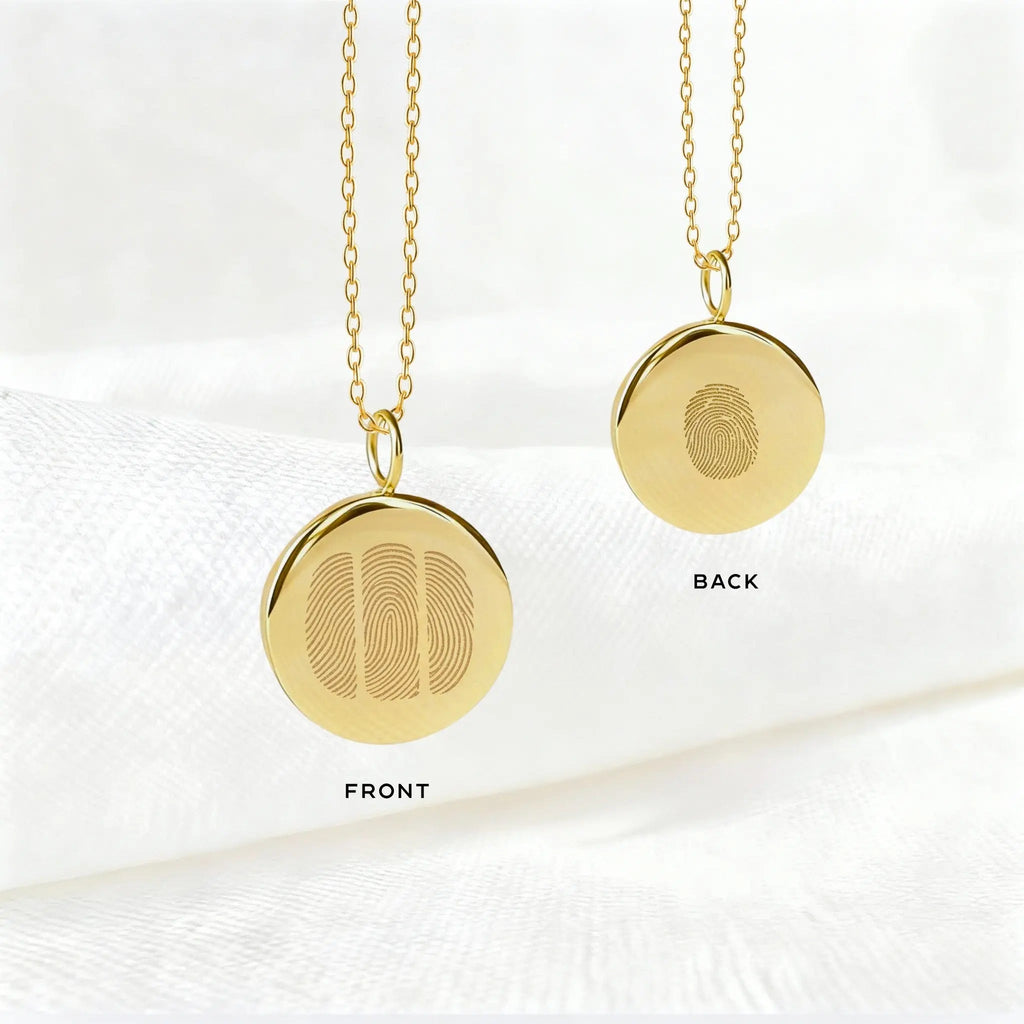 Double-sided Three Fingerprint Coin Necklace in 18K Gold Vermeil by Atelier By DSGN showing the front and back engravings. The front features three intricate fingerprints symbolising deep personal connections, while the back showcases an additional custom engraving — perfect for names, dates, or personal messages in a timeless keepsake design.